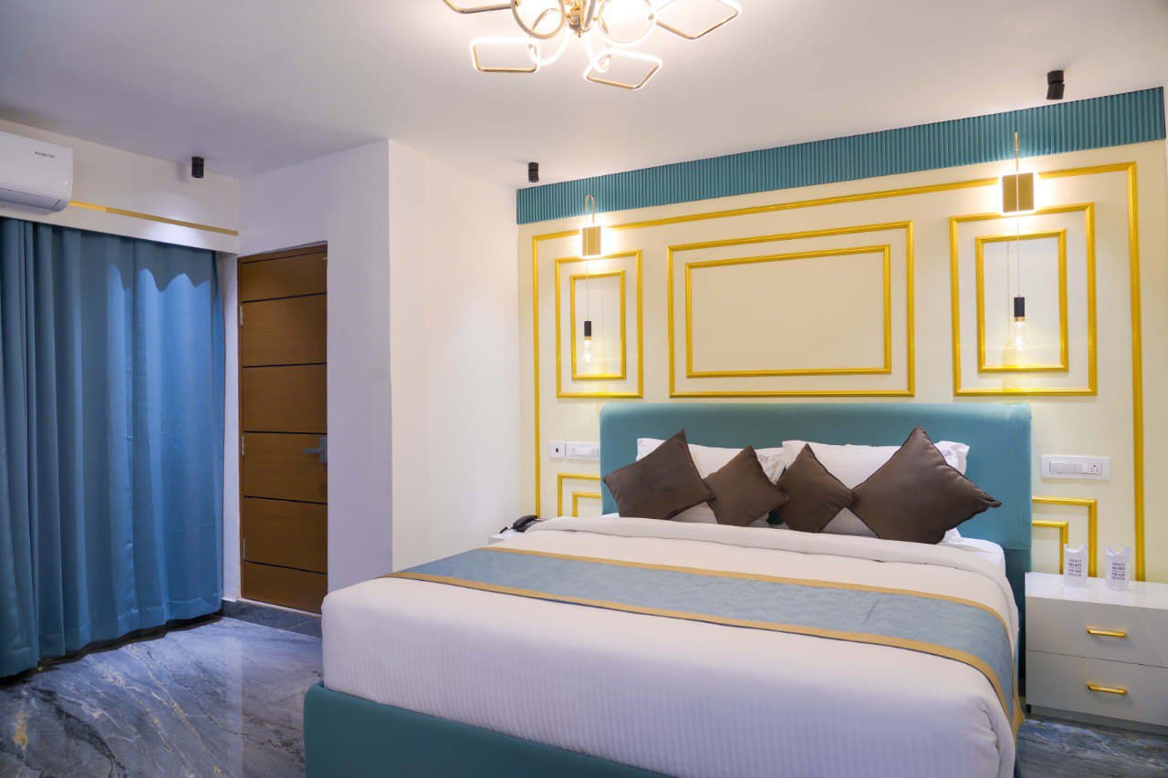 Private Pool Villa Suite bedroom with teal and gold headboard