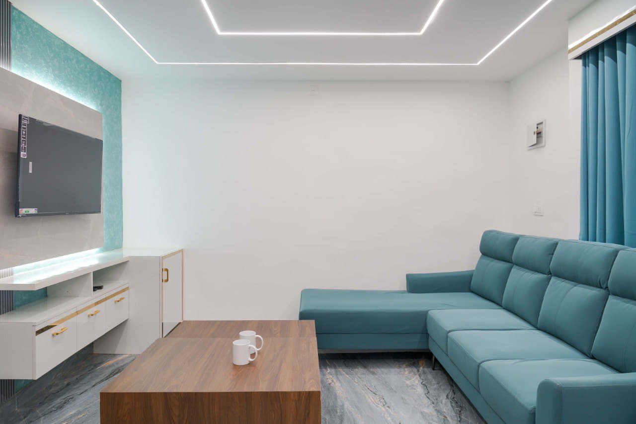 Private teal-sofa lounge with TV unit